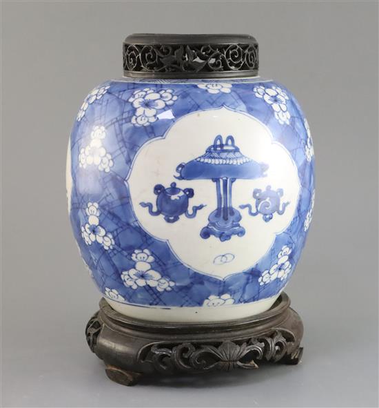 A Chinese blue and white Antiques jar, Kangxi period, H. 21cm, wood cover and stand